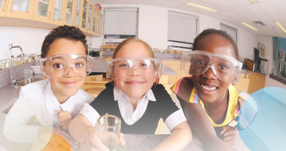 Three kids in a science lab