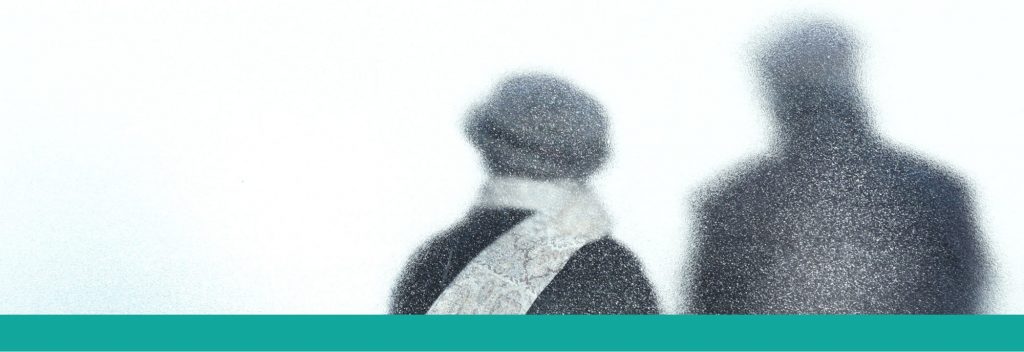 Two silhouettes through a frosted window