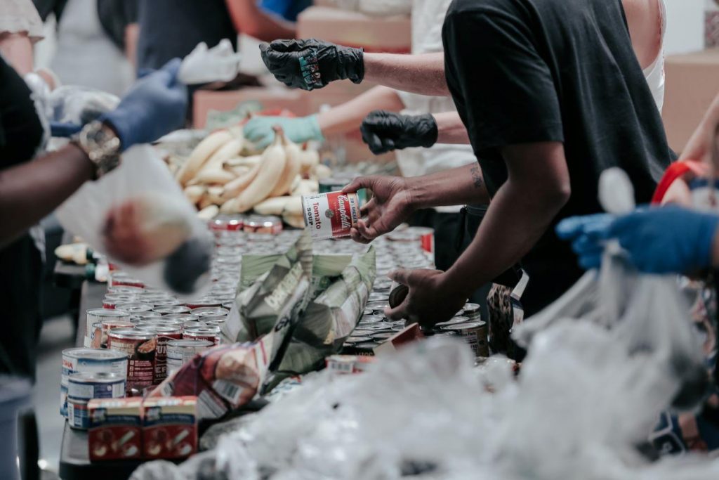 Food bank workers sort groceries
