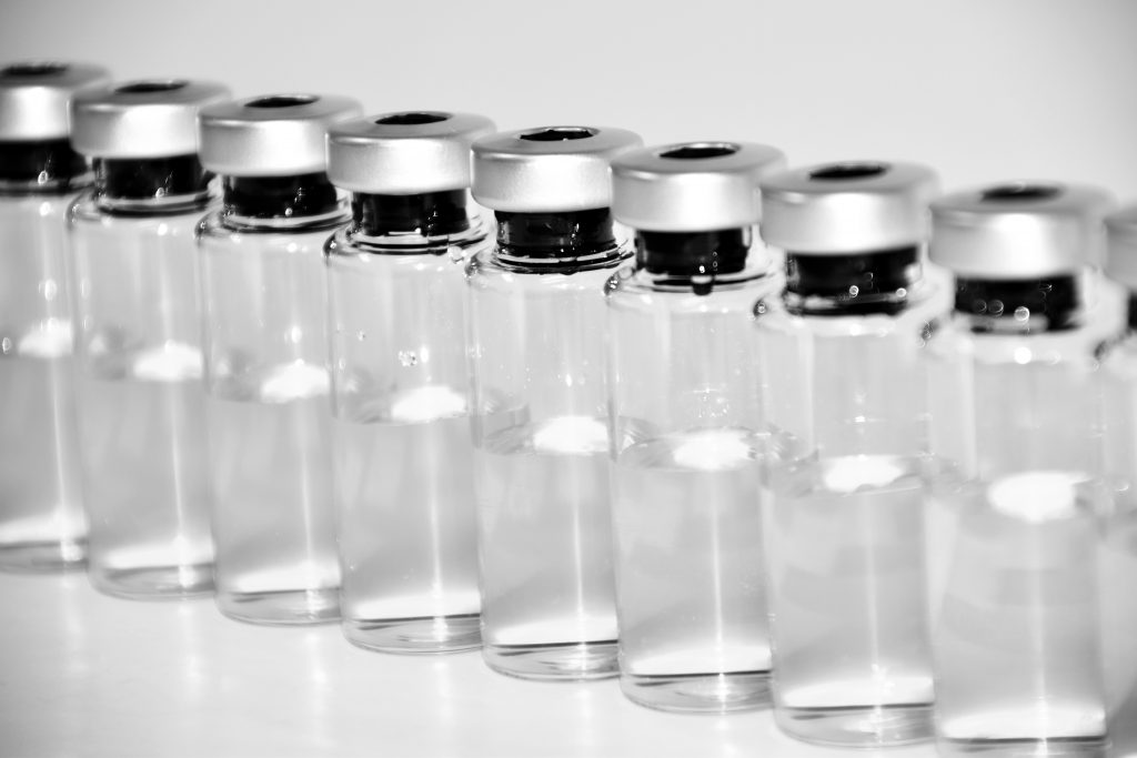 Row of Unlabeled vaccine bottles