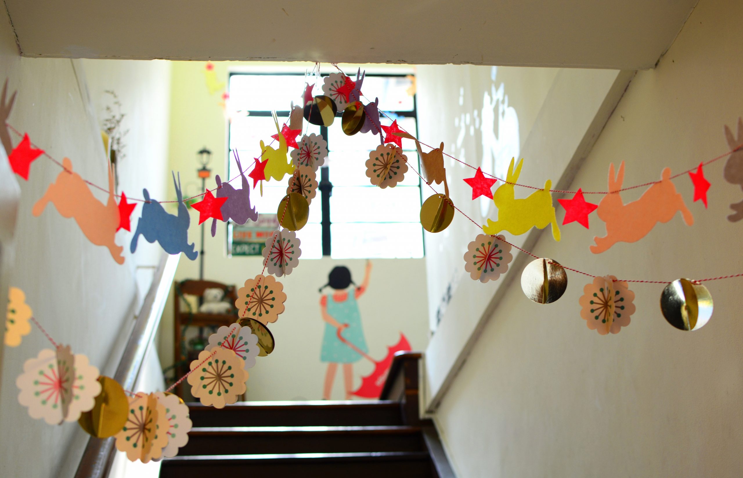 Craft Banners hanging in a elementary school stair well.