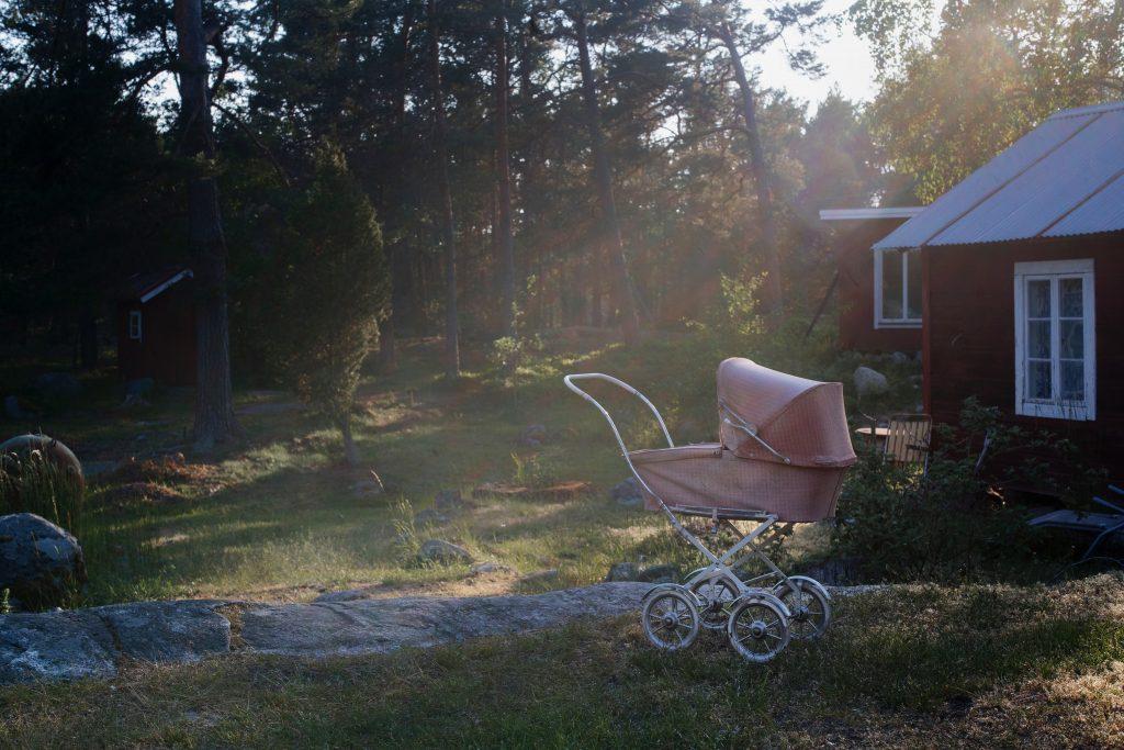 Baby carriage in sunset