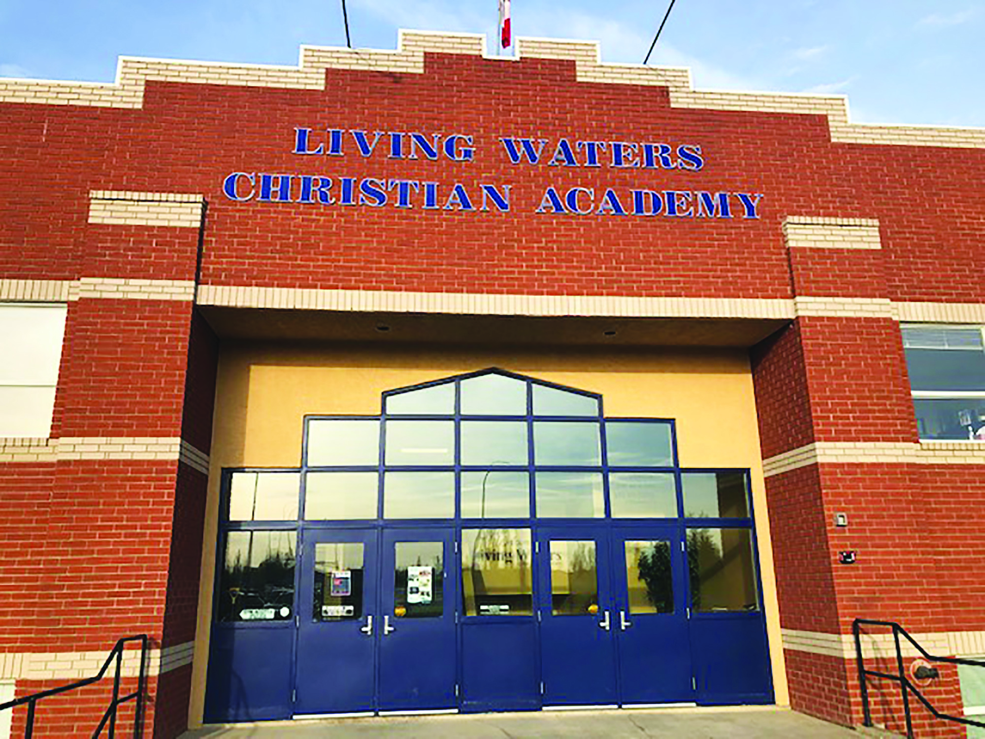 Front door and sign of school