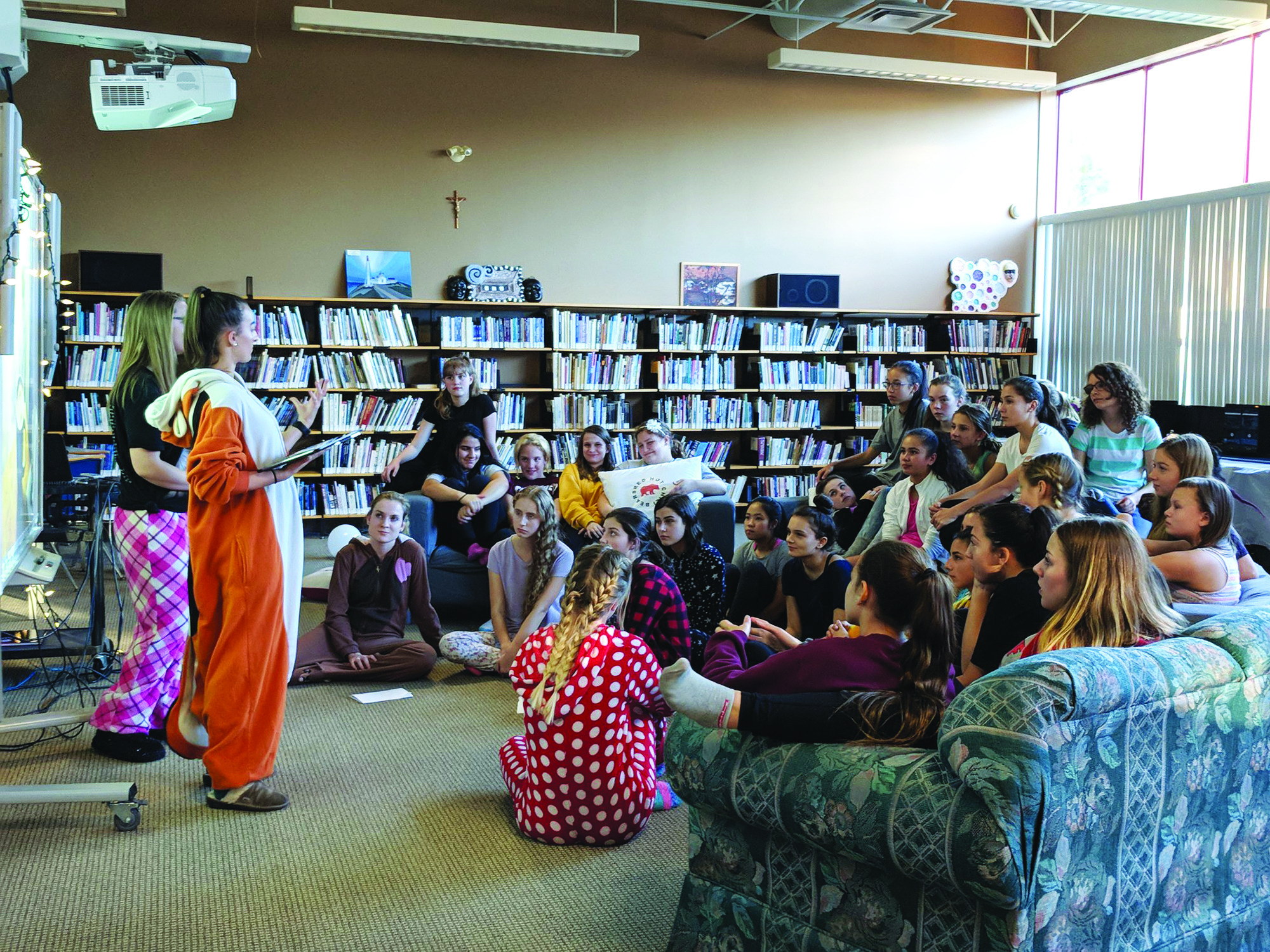 Students participate in a club meeting.