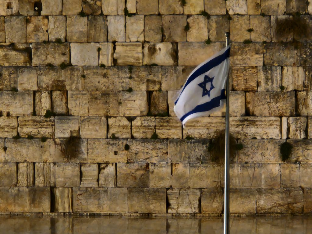 The Israeli flag in front of the Western Wall.